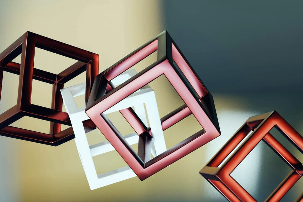 Abstract metallic geometric cubes on a soft neutral background